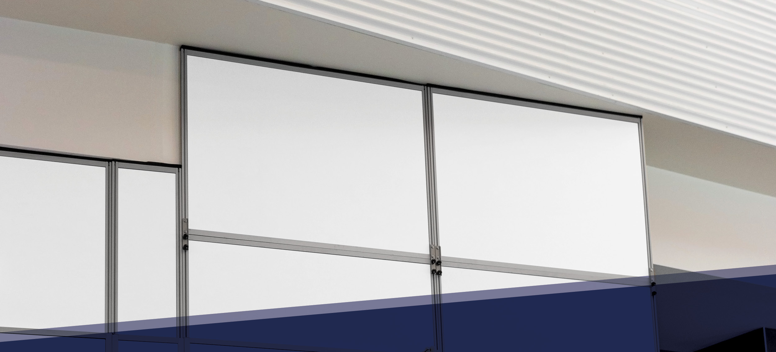 Abatement Technologies SHIELD WALL panels connected to a multi-level ceiling