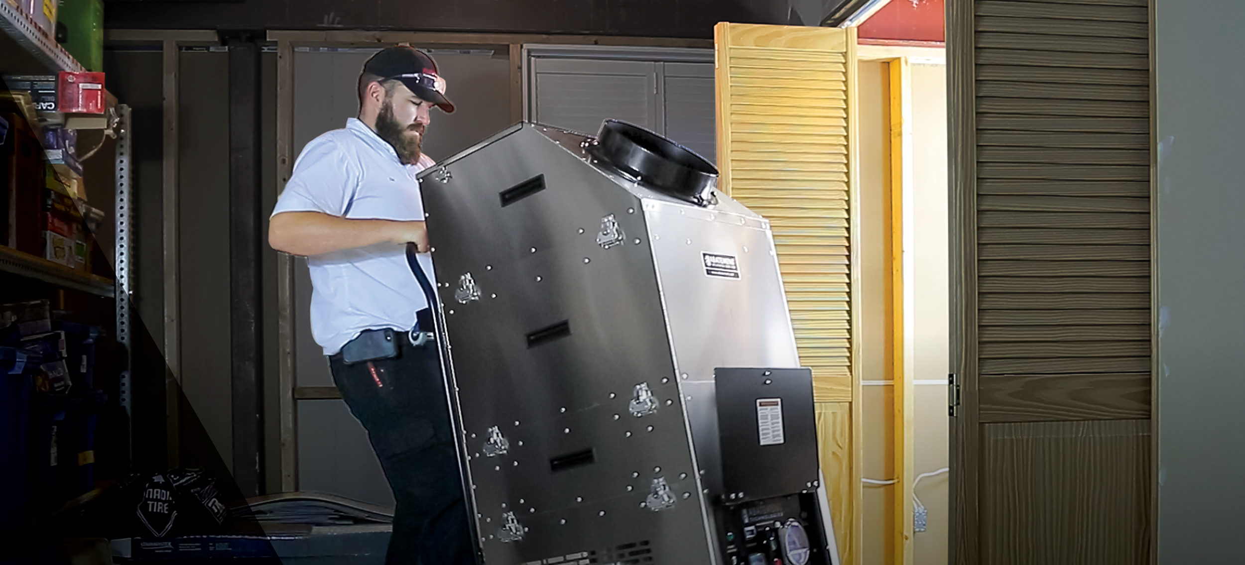 Restoration professional moving a commercial-grade air scrubber with HEPA filtration into a residential space for post-disaster cleanup. Ideal for mold remediation, water damage restoration, and improving indoor air quality after flooding or hurricanes.