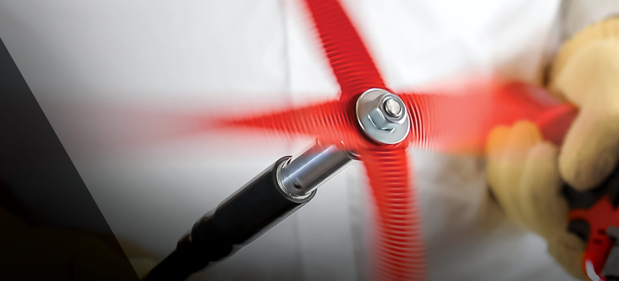 Close-up of a high-speed rotary duct cleaning brush in motion during an HVAC system cleaning. The spinning red bristles are designed to remove dust, debris, and contaminants from air ducts to improve airflow and indoor air quality.